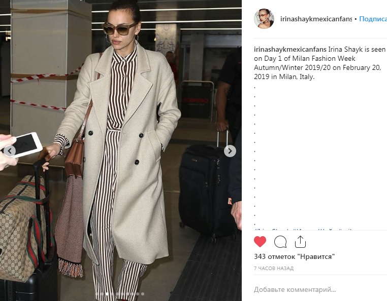 Элегантное пальто и полосатый комбинезон: Ирина Шейк прилетела на Неделю моды в Милан