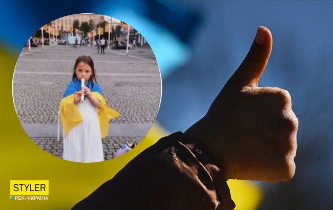 В Днепре 6-летняя девочка игрой на флейте собирает деньги на армию (видео)